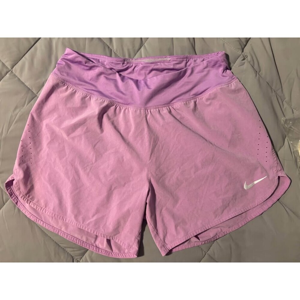 Nike Women's LARGE Running Shorts with hidden pockets and drawstring